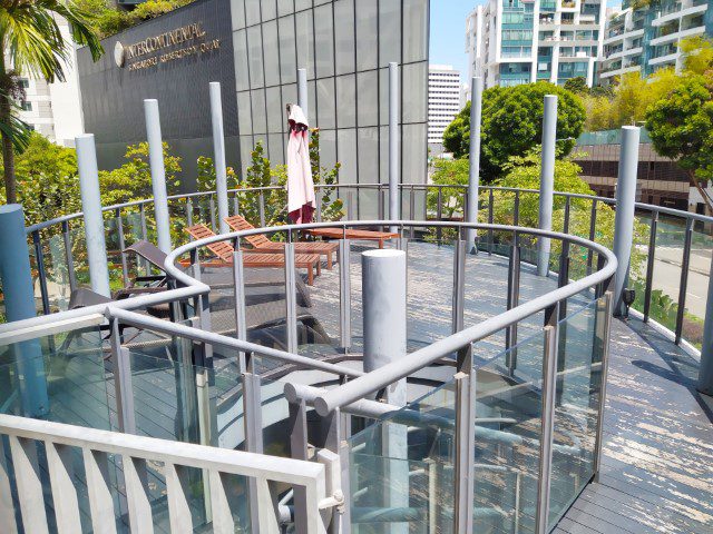 Deck chairs for suntans at Studio M Hotel Swimming Pool Level