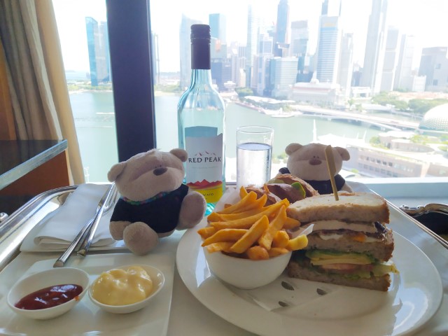 Enjoying Mandarin Oriental Club Sandwich with wine while enjoying views of Marina Bay