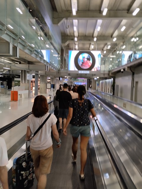 Endless travelators to Arrival Hall at Bangkok International Airport
