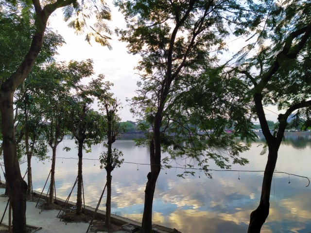 Shot of Truc Bach Lake with clouds reflected while sitting at Standing Bar Hanoi