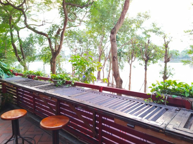 Horizontal tables at level 2 of Standing Bar Hanoi, overlooking Truc Bach Lake