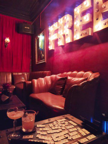 Ambience inside Unicorn Pub Hanoi - Cushioned leather seats further inside 