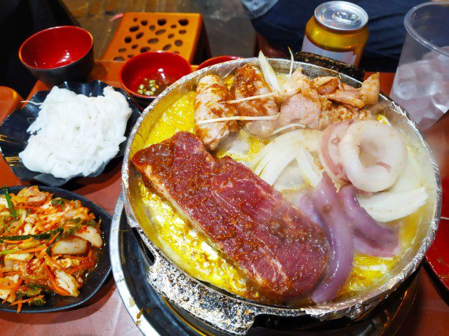 Ingredients with loads of butter at Hanoi Vietnam roadside BBQ Buffet