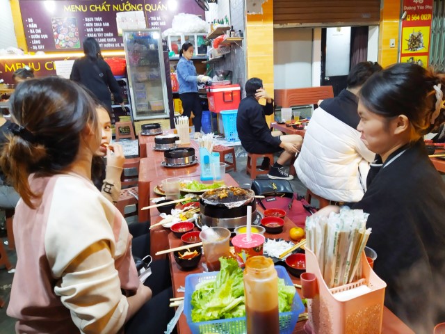 Many tables of locals enjoying the Friday evening at BBQ Buffet Vietnam Hanoi