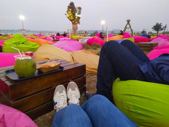 Lounging on bean bags at Six Doong Cafe Vuon Hoa Phuong Linh Hanoi Botanical Gardens