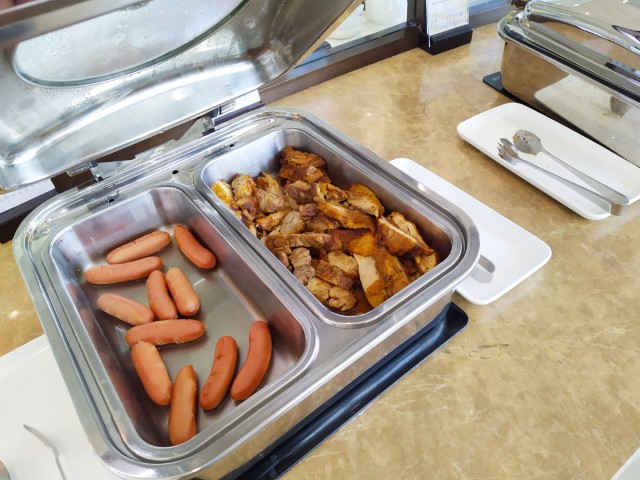 Buffet Spread at Song Hong Business Lounge Hanoi International Airport - Western selection of sausages and grilled chicken