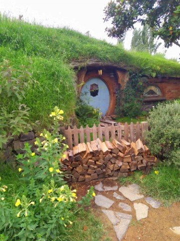 Hobbit Hole at Hobbiton where cut wood is outside - looks like it is still habited 