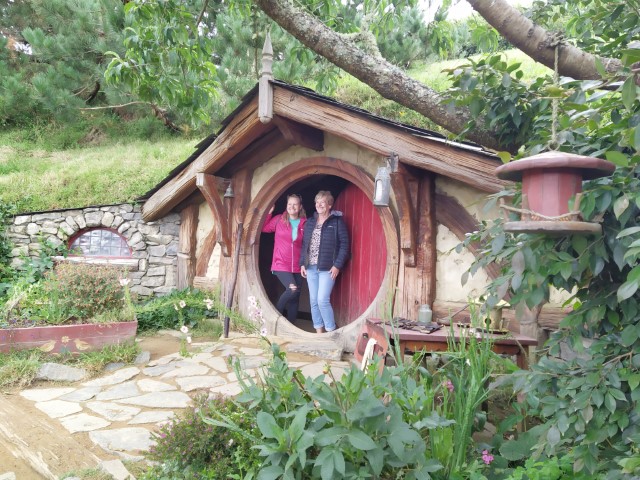 Mandatory photo with a Hobbit Hole before reaching Bilbo Baggin's Hobbit Hole in the Shire, Hobbiton