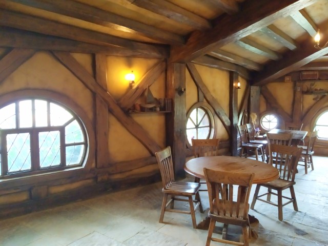 Seating areas inside the Green Dragon Inn Hobbiton