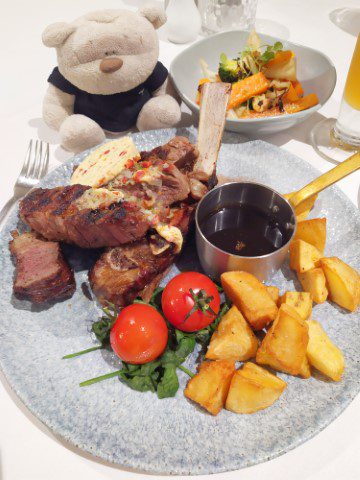 Edgewater Restaurant Taupo Rib-Eye On The Bone (500g) steak ($68) with duck fat potato, cherry tomato and seasonal vegetables on the side