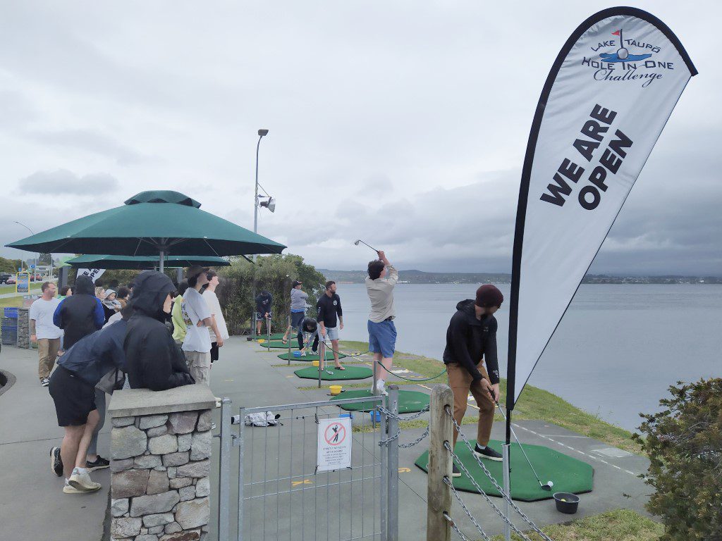 Visitors trying out the Hole-In-One Challenge at Lake Taupo