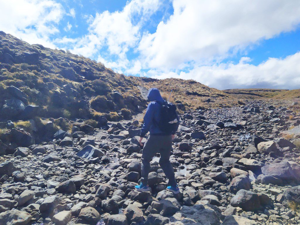 Crossing a field of stones , rocks and pebbles enroute to Tama Lake