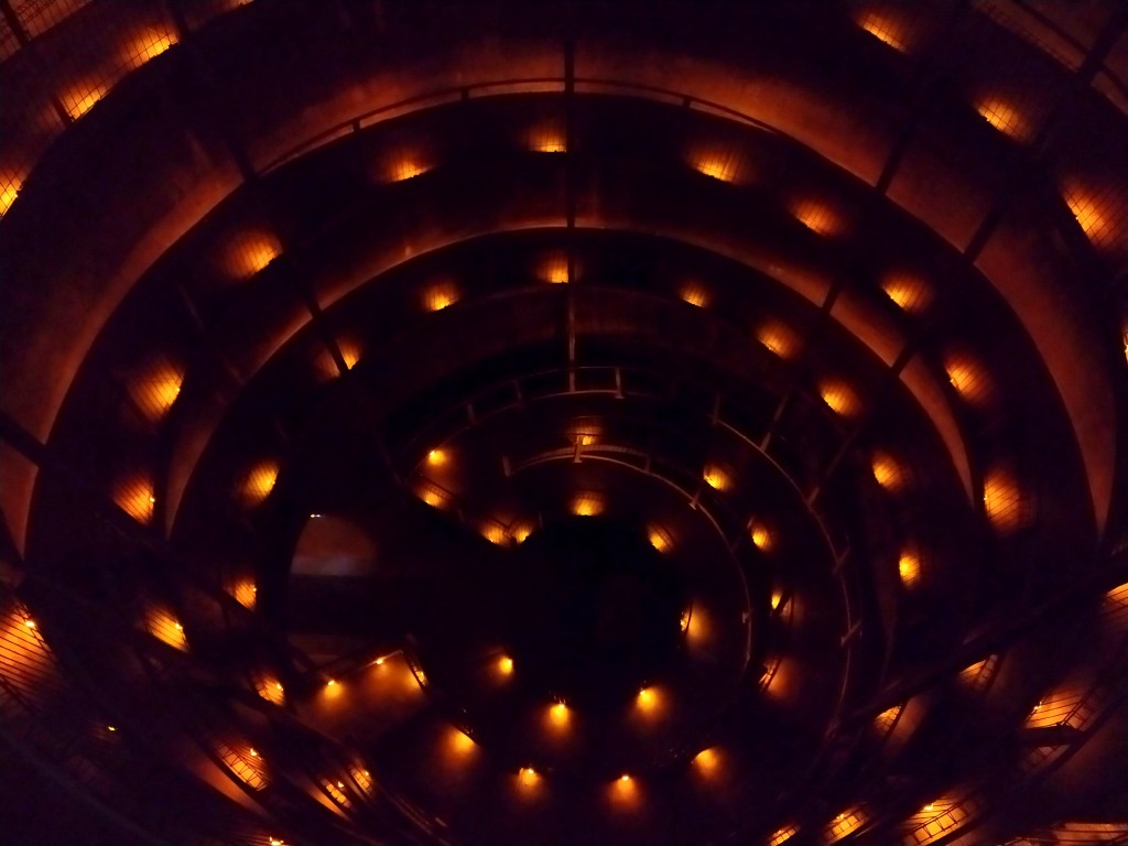 Descending through a circular pathway down to Waitomo Glowworm Caves entrance