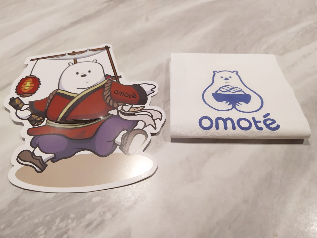 Omote bear greeting us at the table of Omote Thomson Plaza Flagship Review