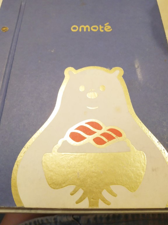 Omote Menu with a golden Omote bear feasting on his Chirashi