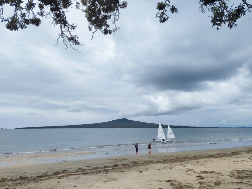 Locals having fun by the waters at Narrow Neck Beach Auckland