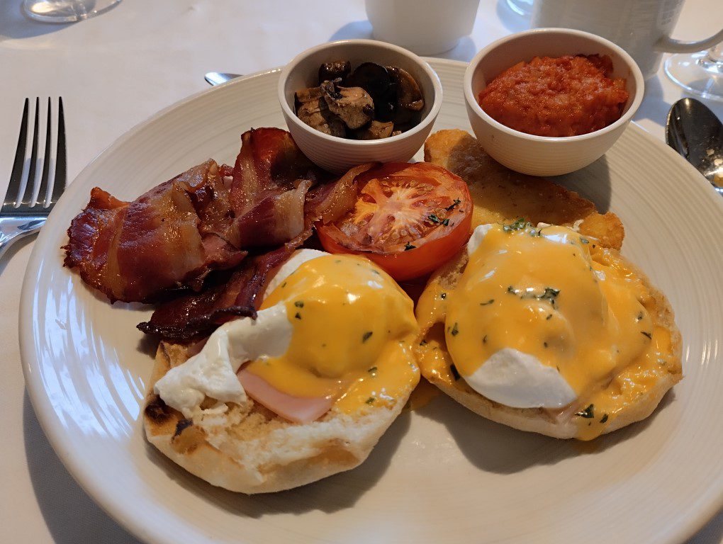 Spectrum of the Seas Main Dining Room Breakfast Eggs Benedict with bacon, mushroom, corned beef, hashbrown (Royal Caribbean Cruise)