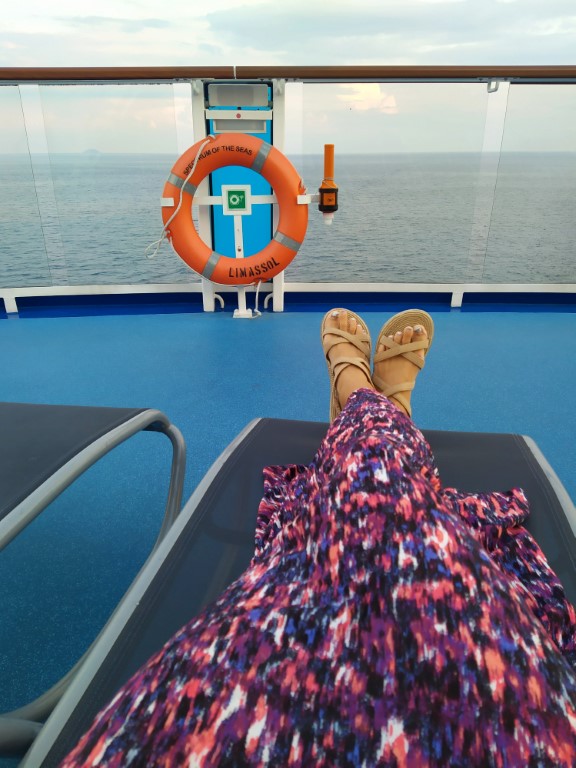 Kate decking out while Tom exercised on Spectrum of the Seas Royal Caribbean Cruise aft of deck 15