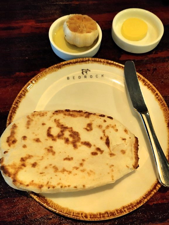 Bedrock Bar & Grill crisp bread with freshly roasted garlic and butter