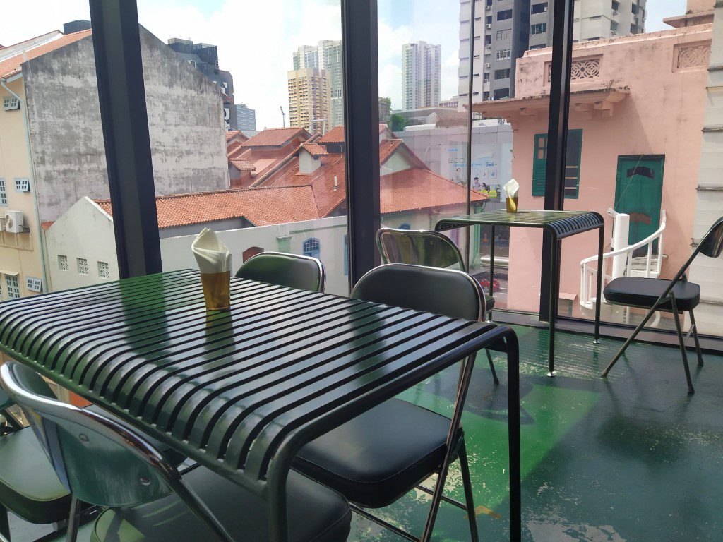 Seats with a view inside Lil's Taproom Craft Beer