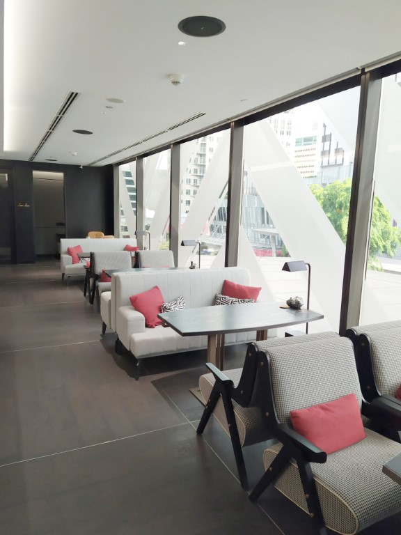 Seating area with views of Orchard Road at Archive Club Lounge of Pullman Singapore Orchard Hotel