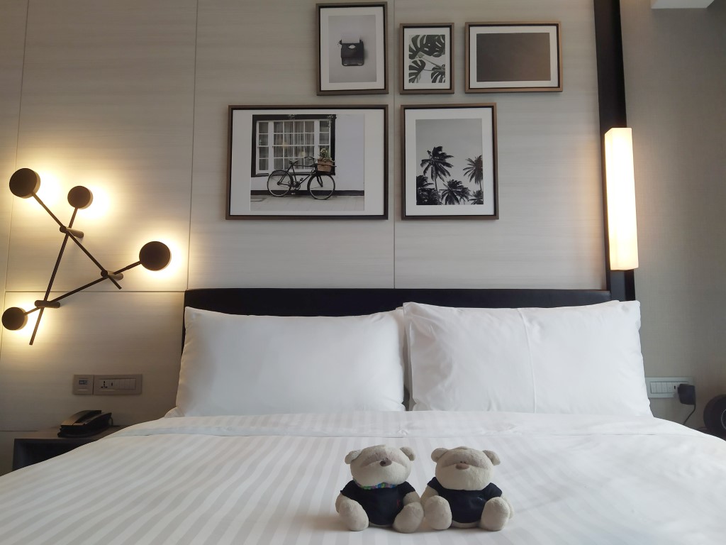 Outpost Hotel Sentosa Deluxe Sea View Room Review - King Size Bed and interior decorations