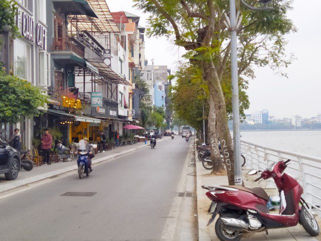 Paths that force you to walk on roads due to motor bikes parked on pavement around Ho Tay Lake Hanoi