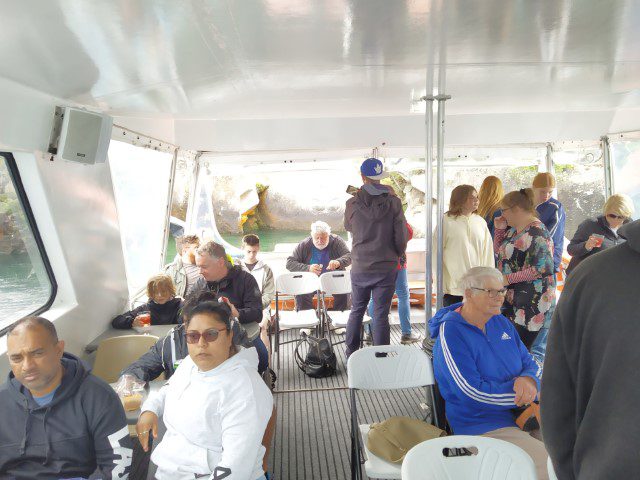 Passengers on Chris Jolly Cruise to Maori Rock Carving on Lake Taupo