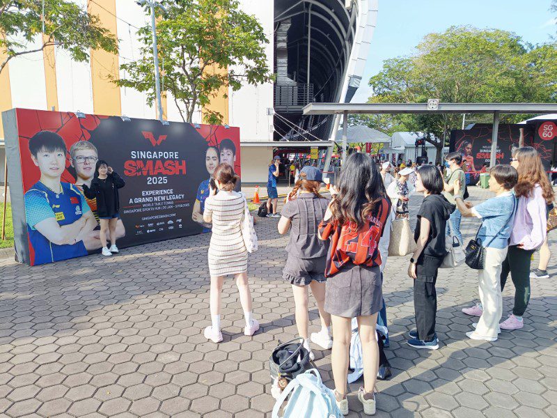 Taking photo with Smash Singapore 2025 Official Banners